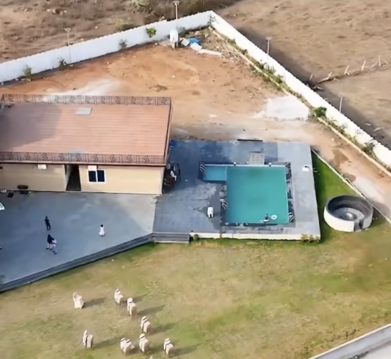 Aerial view of Gala farmstay with swimming pool and lawn for weekend stays near Hyderabad